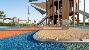 Kids play area outdoor with EPDM safety flooring and shade canopies